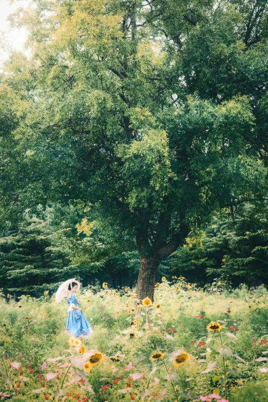 a lady standing in a field with her hair down