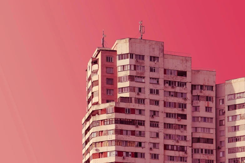 the high rise of a large building with balconies on it