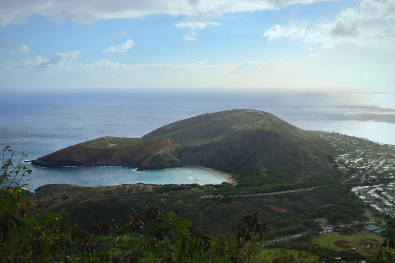 an island surrounded by green land and water