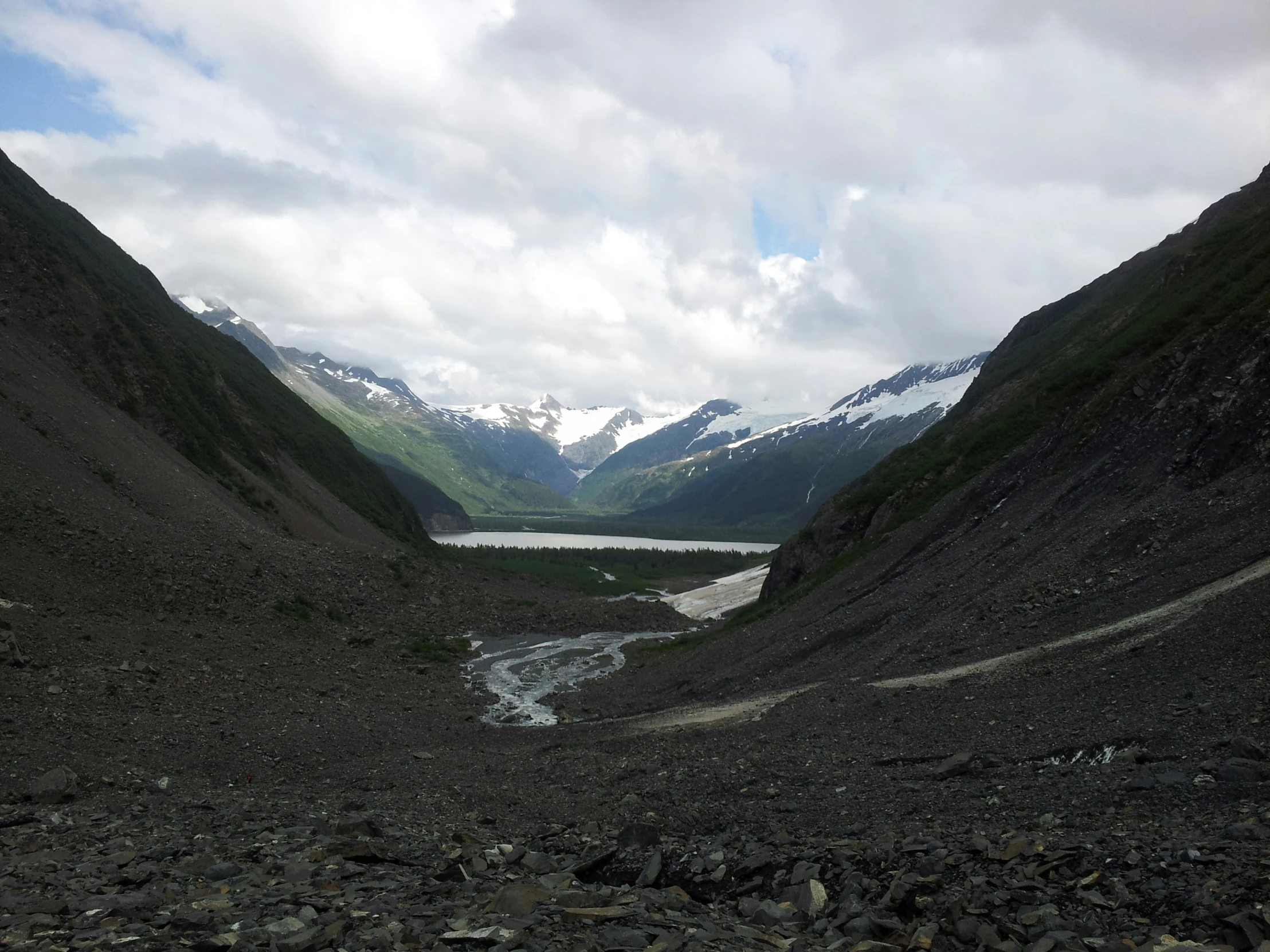 a valley with rocky valleys and water on either side