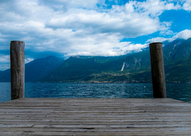 a dock with some wood post sticking out of it