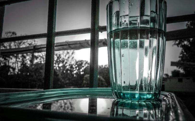 a glass with water on a table