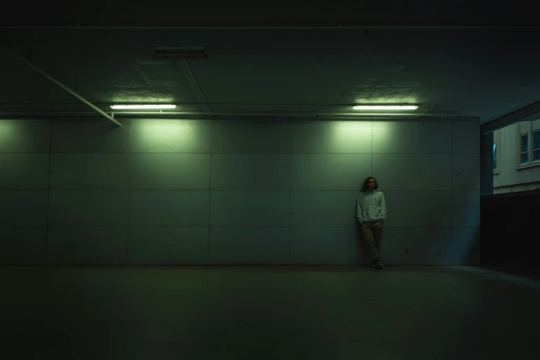 a woman standing alone in an empty room