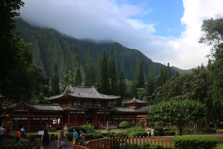 a po of people in front of a mountain range