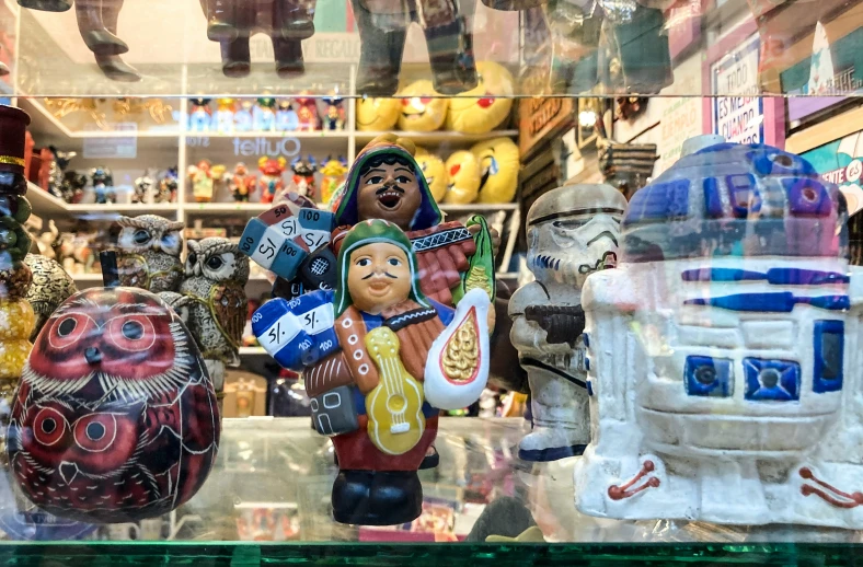 several different kinds of star wars figurines in a store window