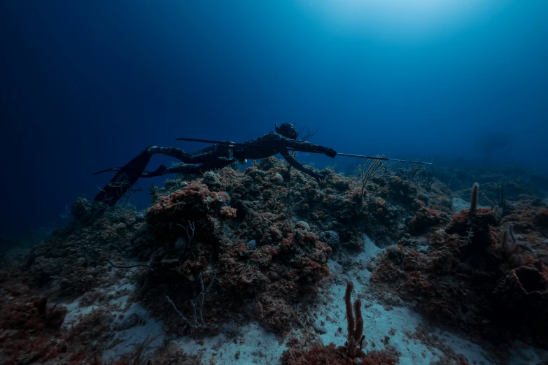 a scuba with long legs and a large arm on a scuba camera