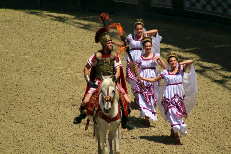 a group of people are riding a horse