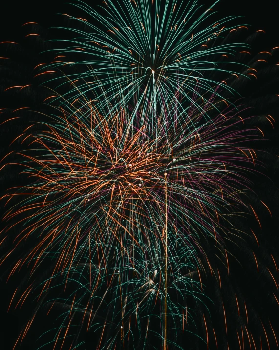 large fireworks exploding up in the air at night