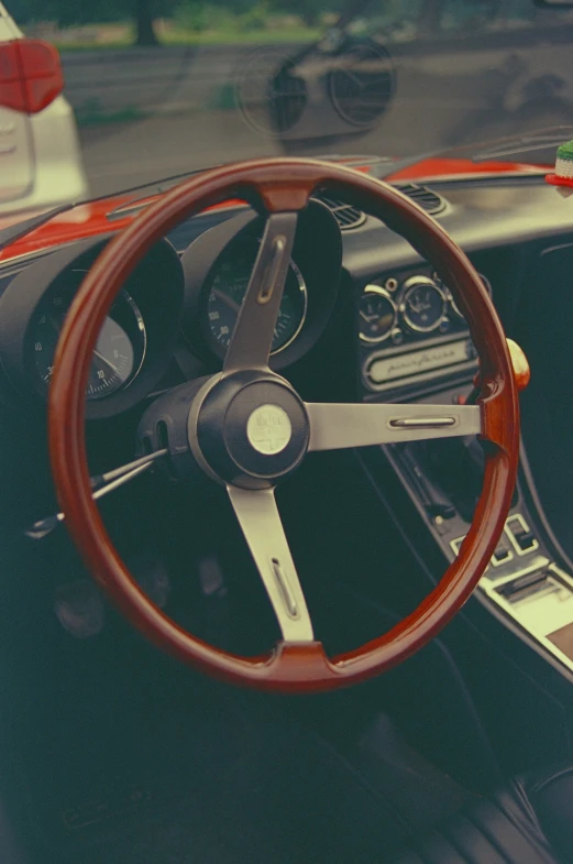 a view from inside an old classic race car, looking inside the steering wheel