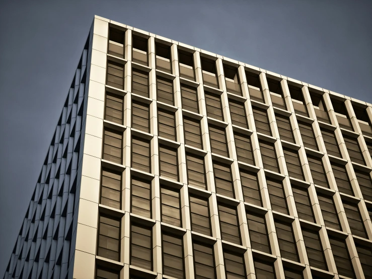 an image of a very tall building as seen from below