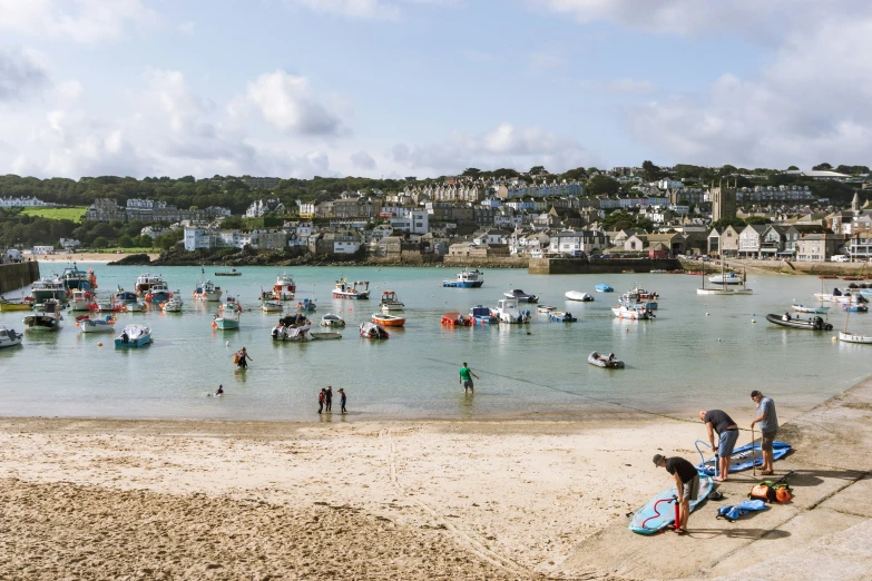 boats float on the water near the shoreline