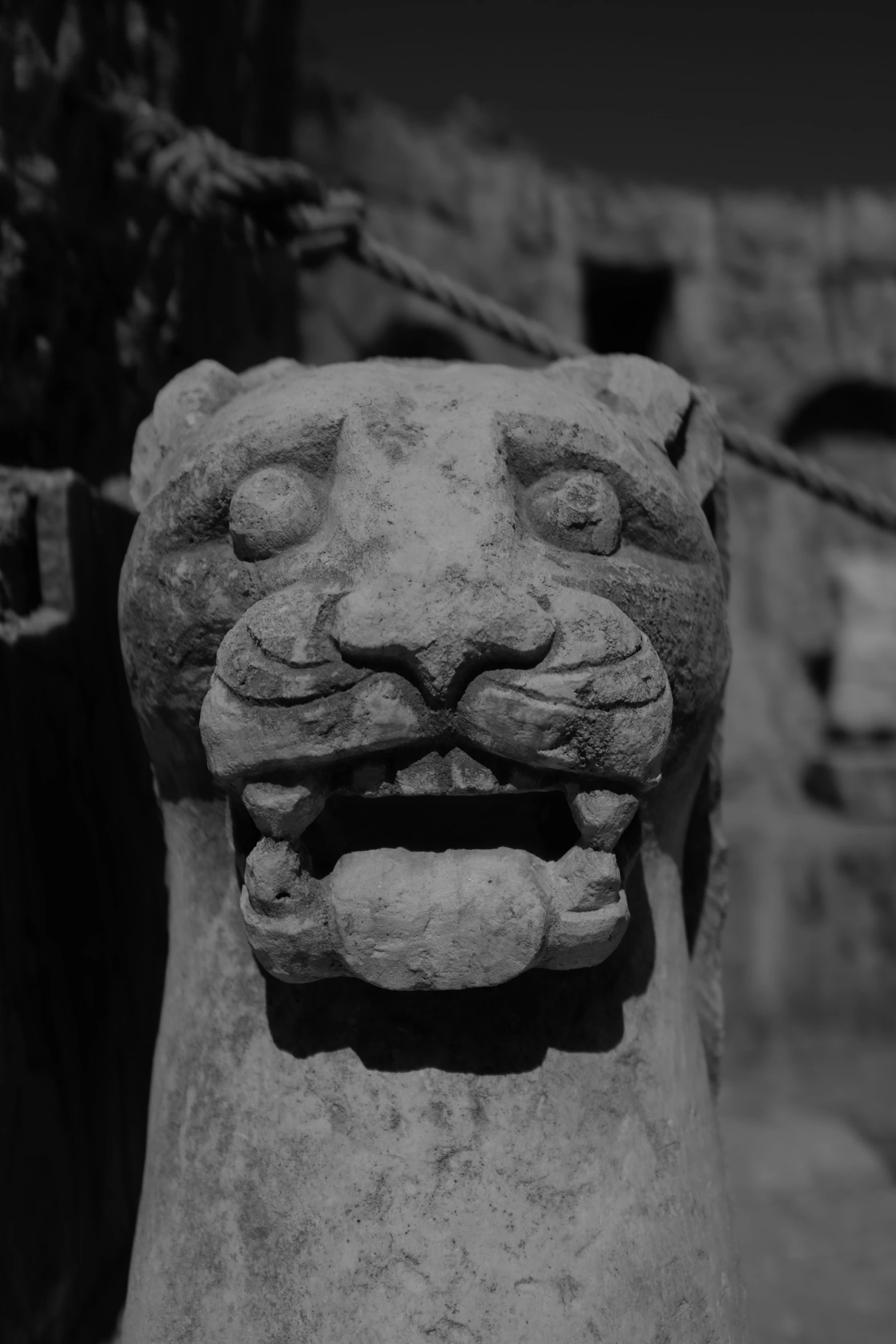 an animal made from stone with a scary look