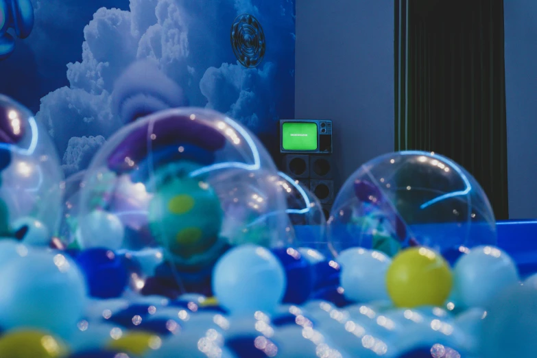 several spheres are on display on a surface