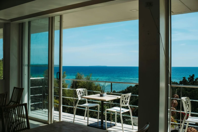 this room has sliding glass doors that lead to the beach