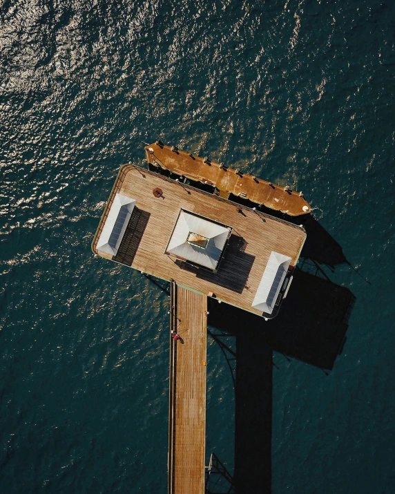 an overhead view shows the water and a large bridge