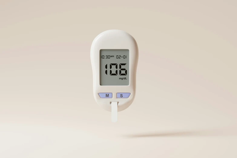 a digital thermometer on top of a white wall