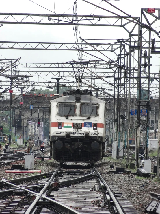 an image of a white train on the tracks