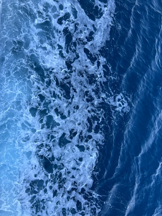 water waves near the ocean wall on an overcast day