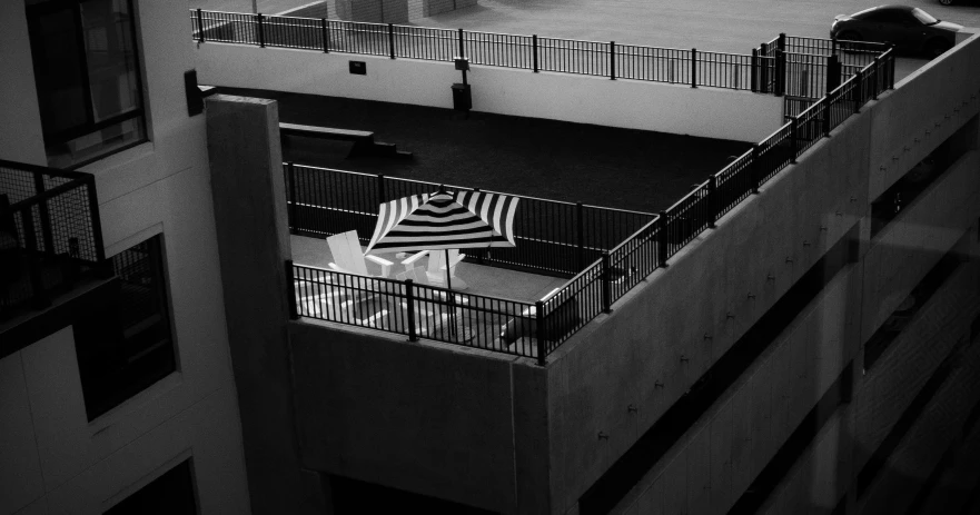 an umbrella sitting up in the middle of a courtyard