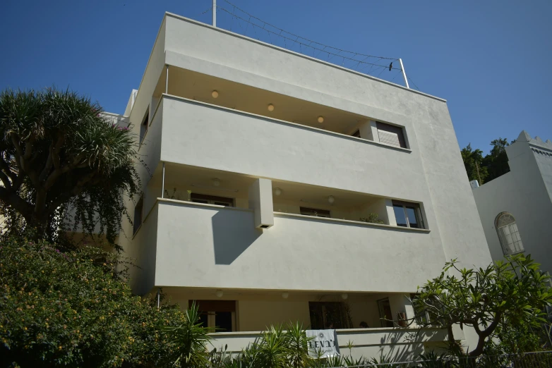 an apartment building with a balcony and balconies