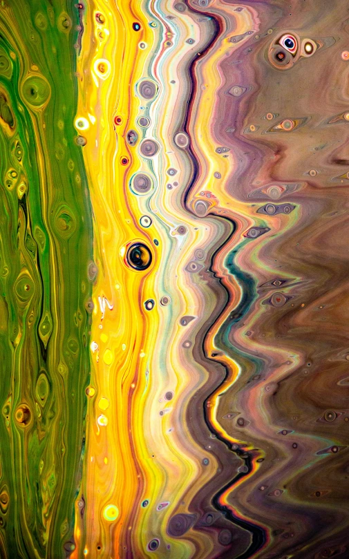 an art piece is shown with colorful streaks of water