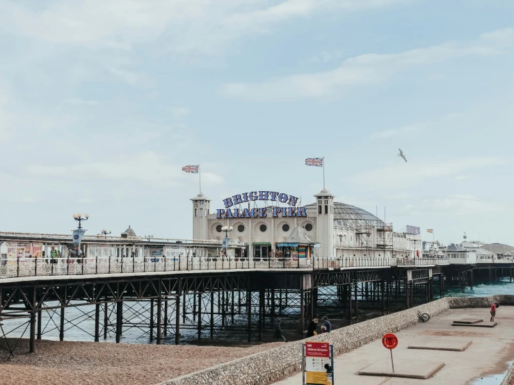 an empty pier with the sea in the background