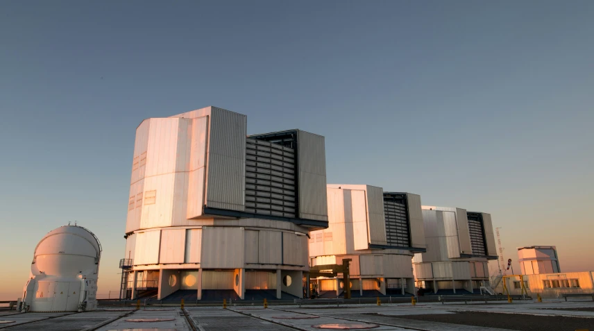 a large array of antenna towers are in the foreground