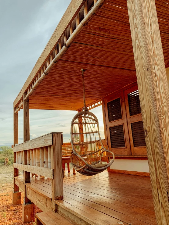 the porch has a hanging chair on it