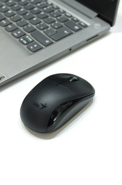 there is a mouse sitting on a computer