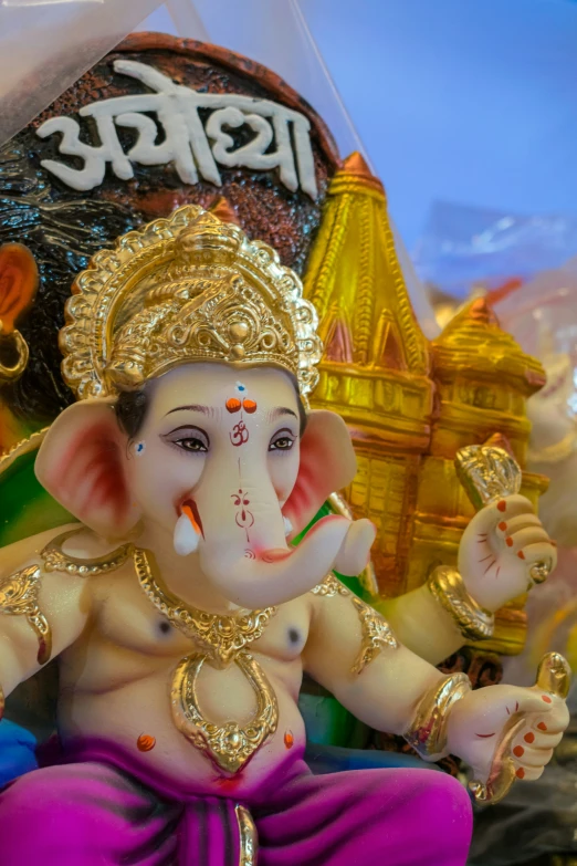 statue with a name of lord ganesh on its body