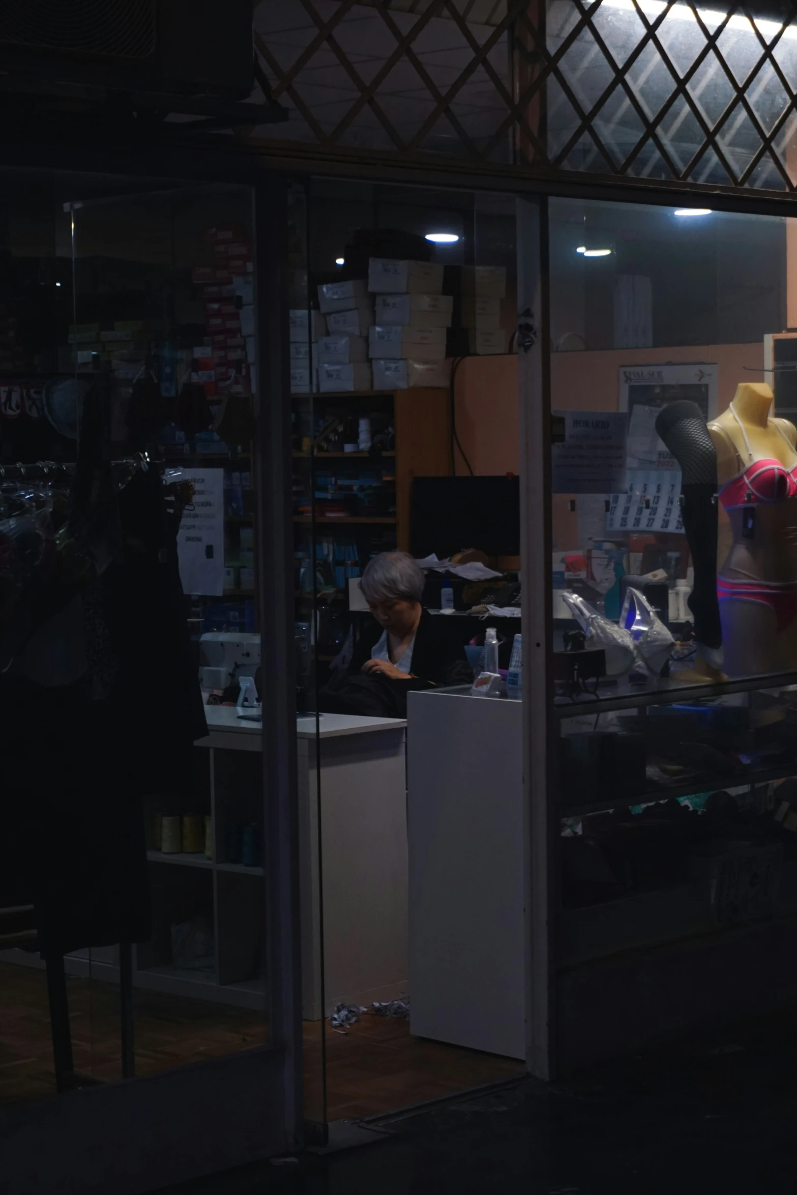 a dress shop with a mannequin on the display