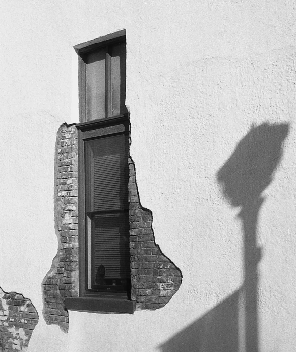 a black and white image with brick windows