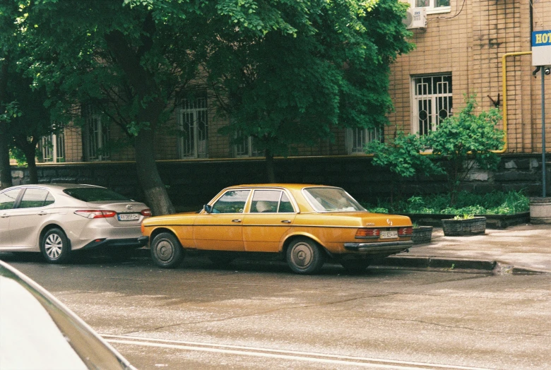 two yellow taxi cabs sitting side by side