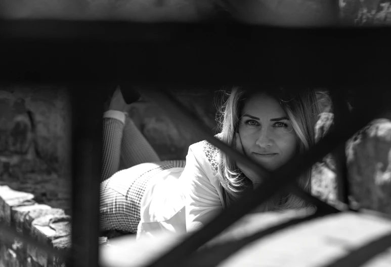 a lady that is laying down in a truck