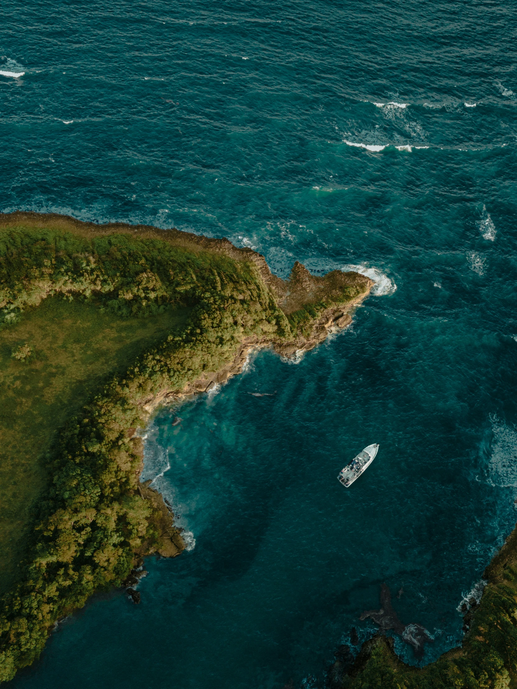 an island surrounded by water and some water boats