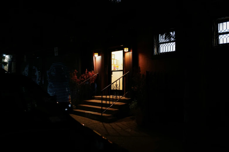 a building with a light at the top and doors open