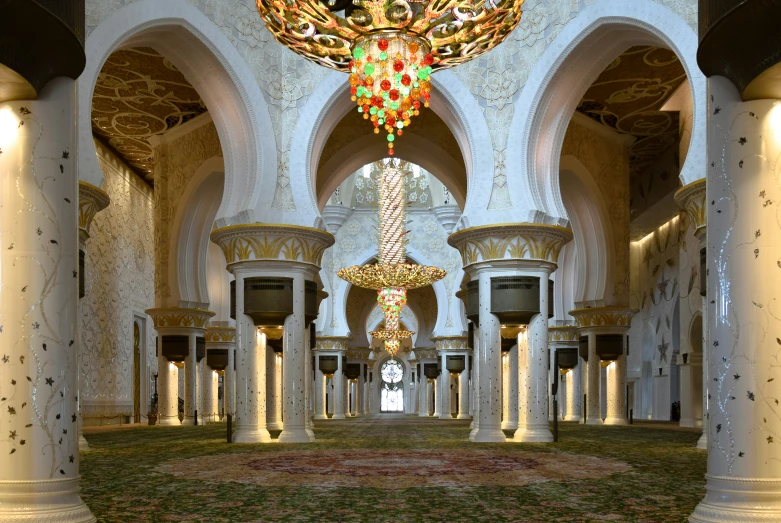 the hallway of an indoor building is decorated with floral ornaments