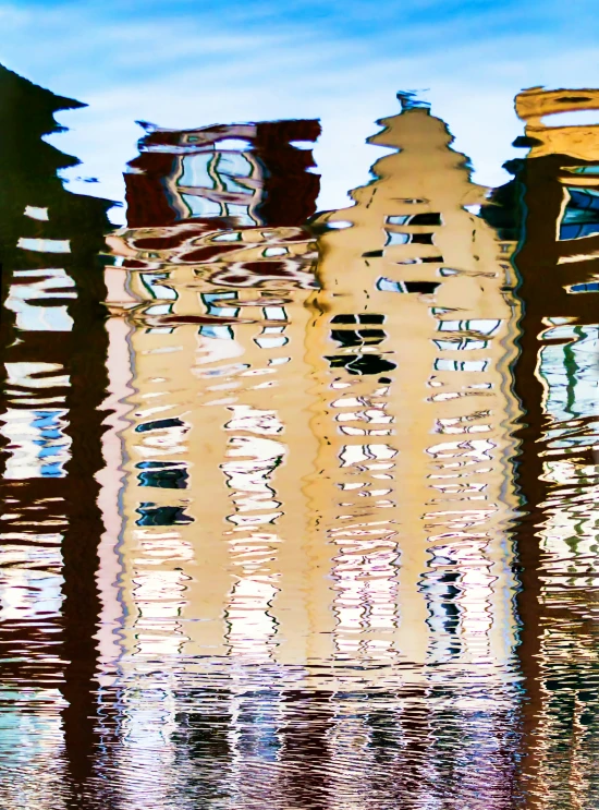 an abstract po of many multi - colored buildings in the water