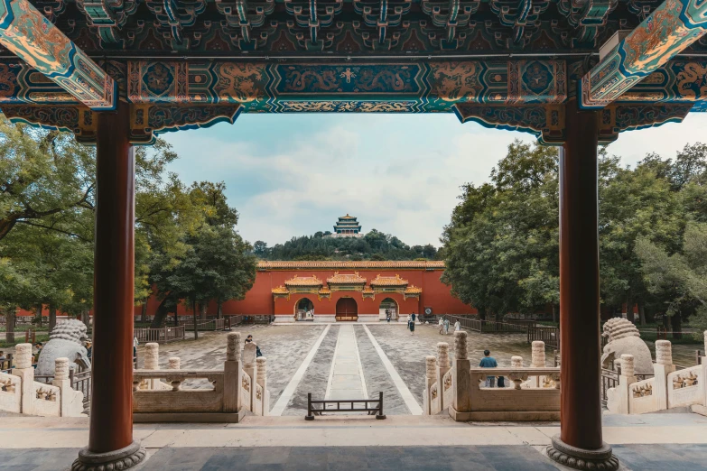 some pillars in front of an outdoor courtyard