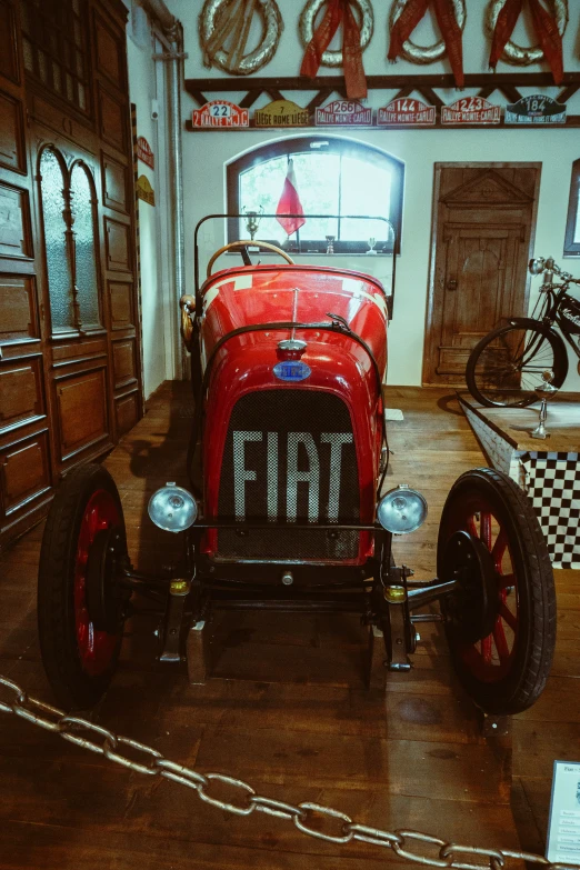 old time antique motor and car parked in a garage