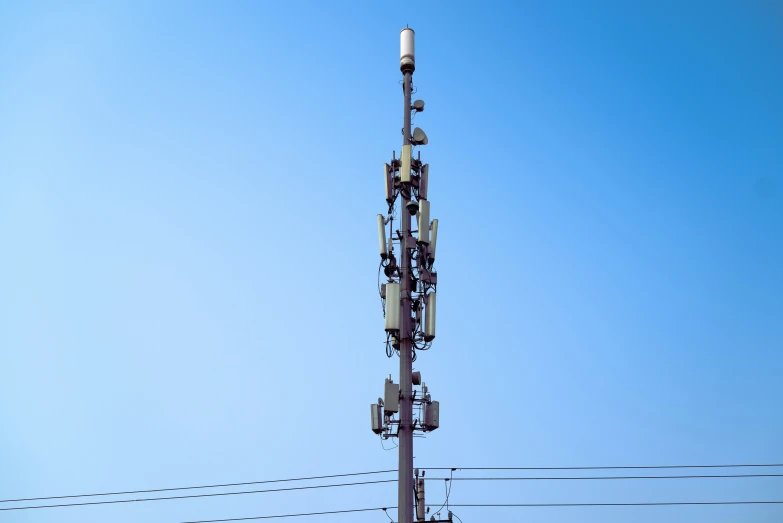 there is a cell tower with the sky in the background