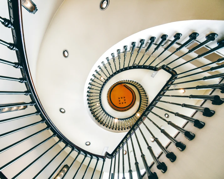 the inside of an ornate staircase with lots of metal rods