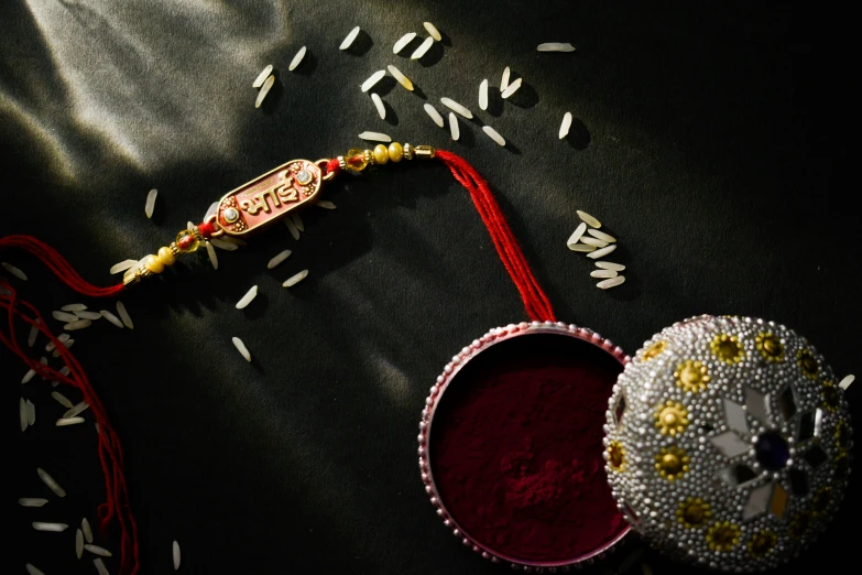 decorative items and a red cloth on a dark table