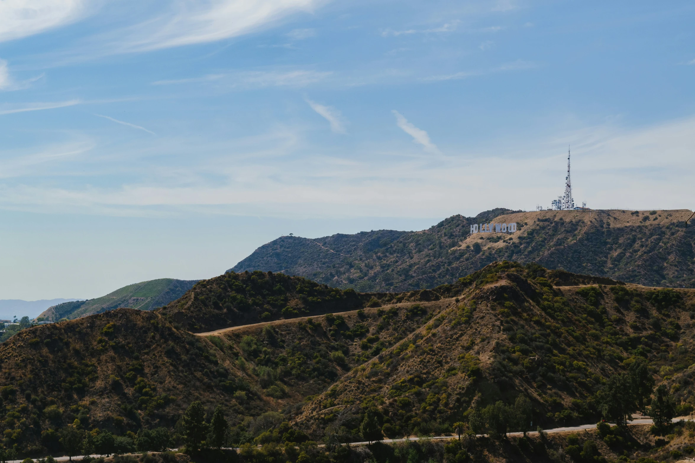 the hills that surround a very tall mountain