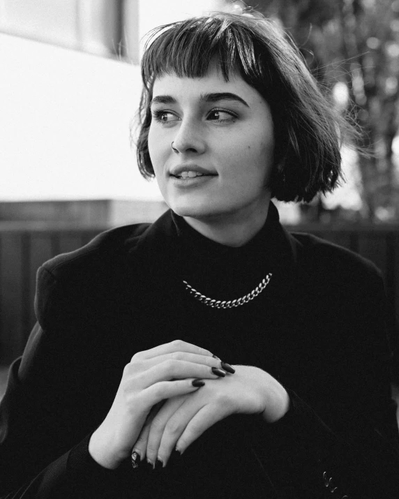 a beautiful woman with short hair posing for a picture