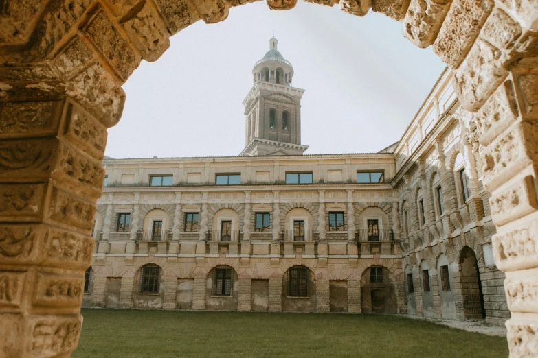 the clock tower is at the end of the building