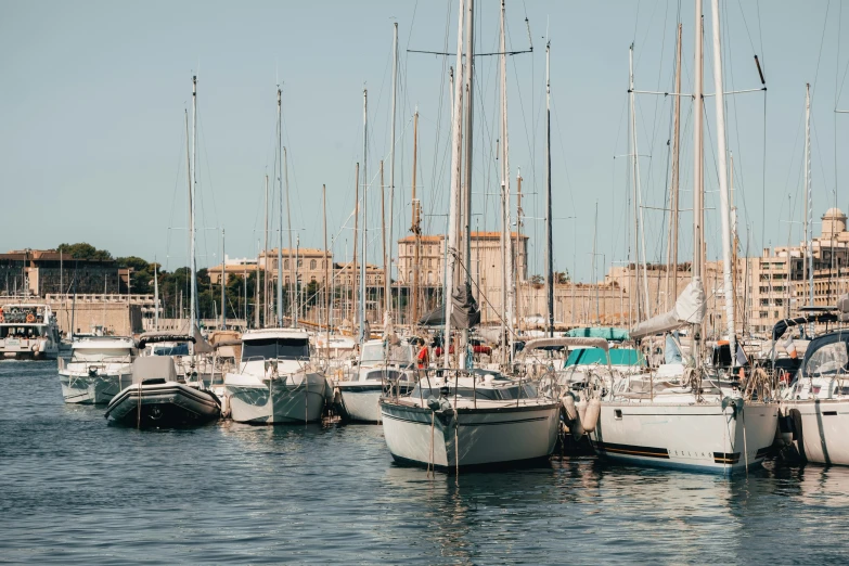 there are many sail boats docked on the dock