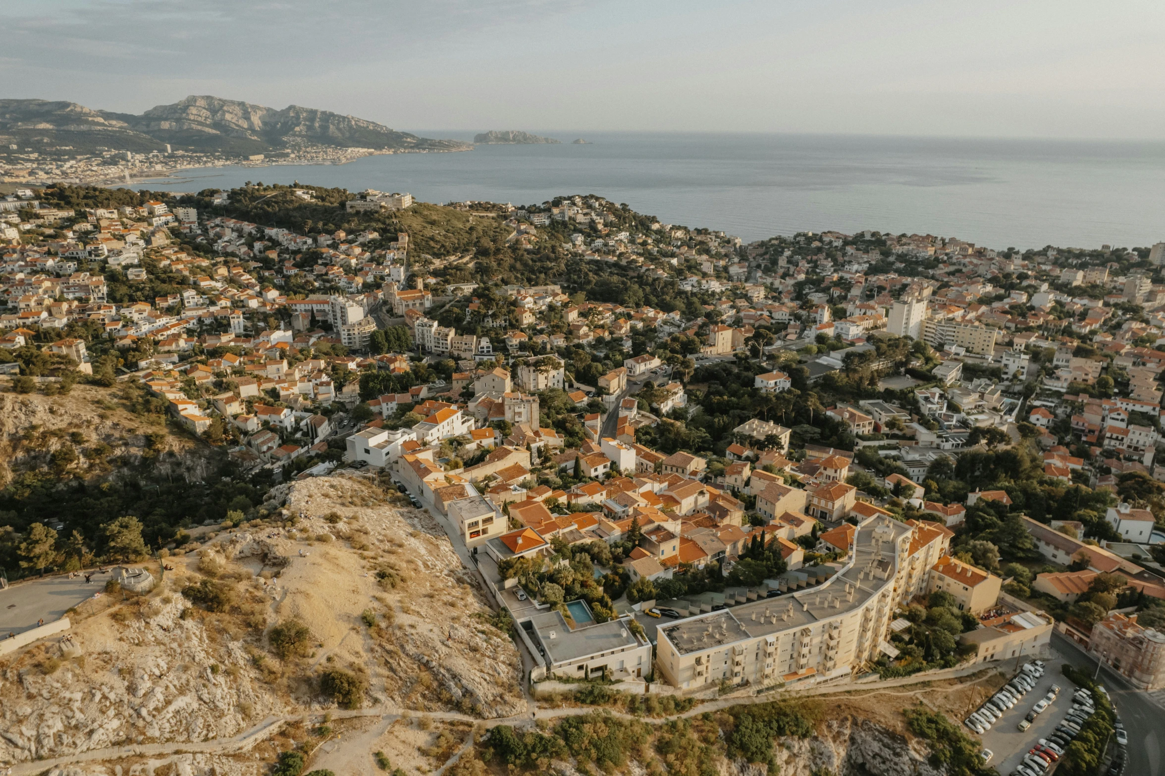 an aerial view of a large city next to the ocean