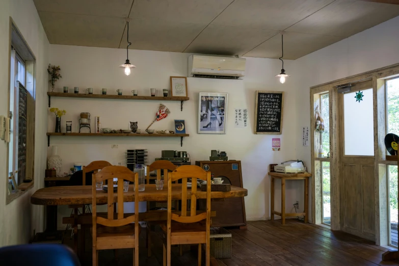 a room filled with wooden chairs and table