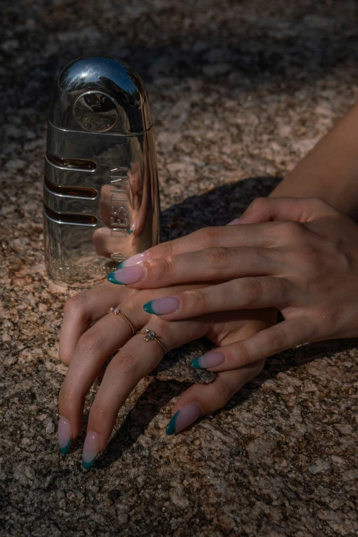 the woman is holding onto her ring on her finger